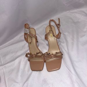 Tan with gold accents. Brand new never worn. strappy heels